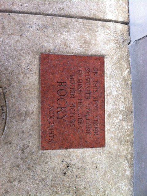 A photo at Pat's of a plaque dedicated to Rocky